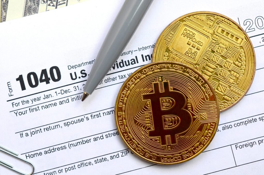 The pen, bitcoins and dollar bills is lies on the tax form 1040 U.S. Individual Income Tax Return. The time to pay taxes - Thor Wealth Managment, Inc. Do I have to pay tax on crypto