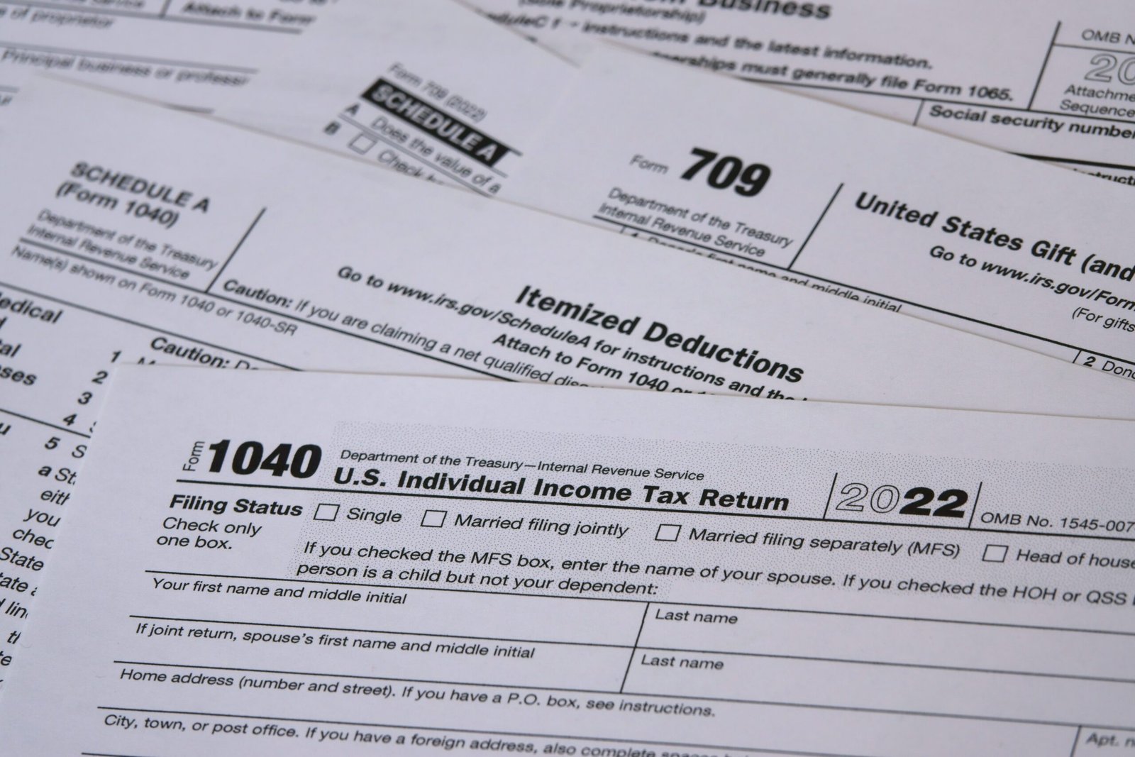 In 2023, a a tax year 2022 IRS 1040 tax form is shown, along with Itemized Deductions (Schedule A) and Gift (form 709) worksheets. The Internal Revenue Service tax filing deadline in 2023 is April 18. - Thor Wealth Managment, Inc. tax planning