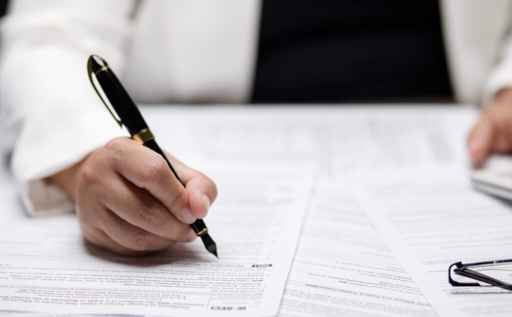 US IRS 1040 form or US Individual income tax Concept,accountant holding pen working on calculator business with data accounting documents and a laptop, pay tax in 2023 years,new year 2024 tax concept - Thor Wealth Managment, Inc. tax planning