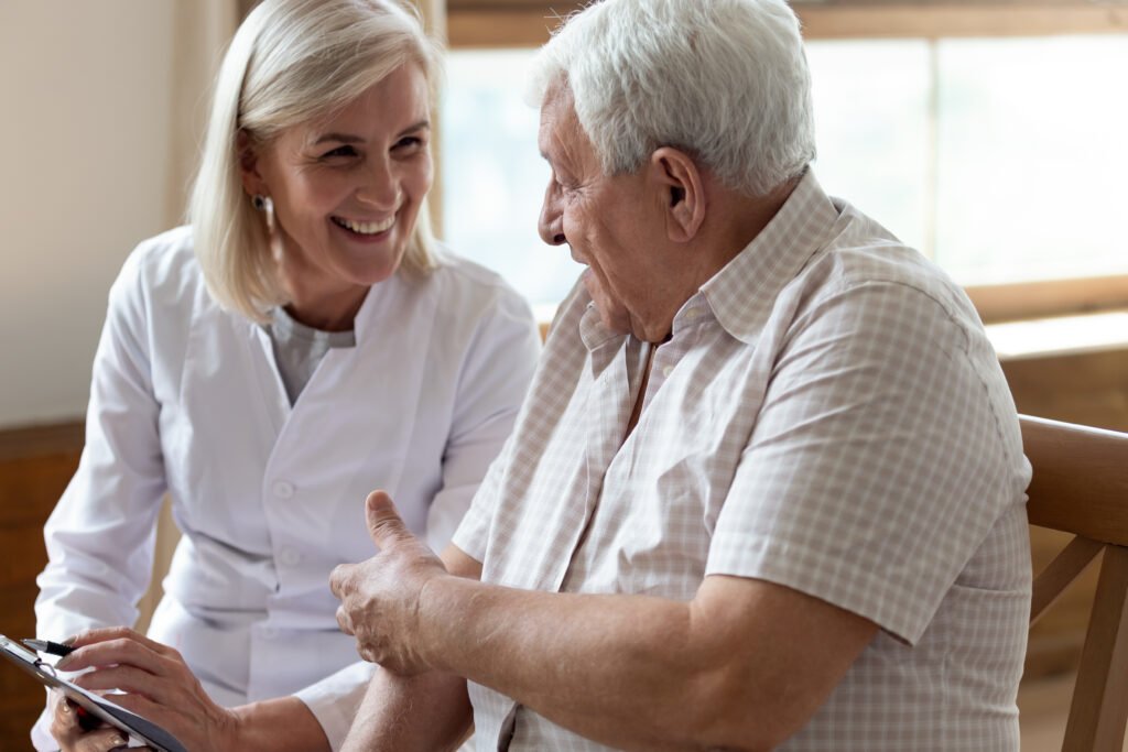 Advisor explaining Medicare enrollment and HSA eligibility rules to an older gentleman.