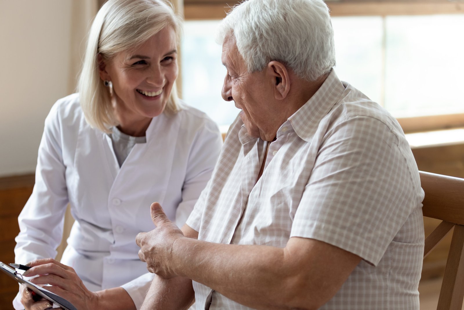 HSA & Medicare - Thor Wealth Managment, Inc. Advisor explaining Medicare enrollment and HSA eligibility rules to an older gentleman.